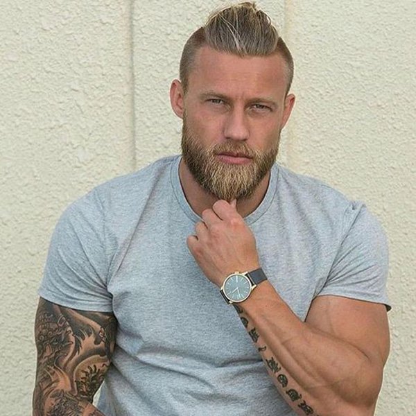 2. High strip of long hair and faded sides, with a medium beard