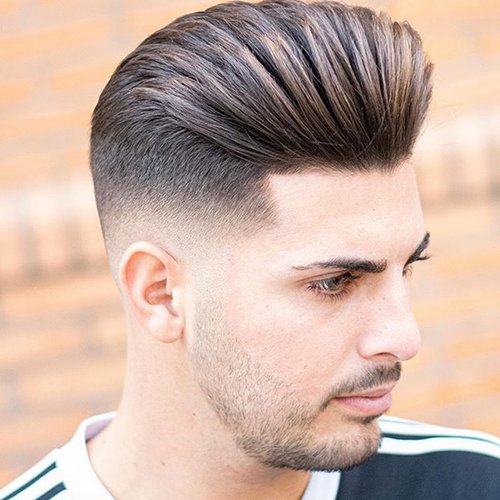 2 - Low fade haircut with swept back hair