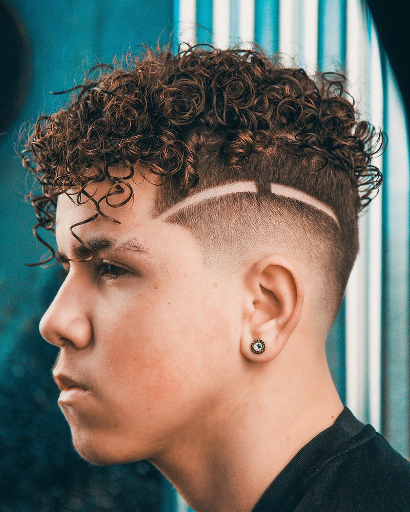 5 Men Curly Fade Hairstyle with Shaved Line