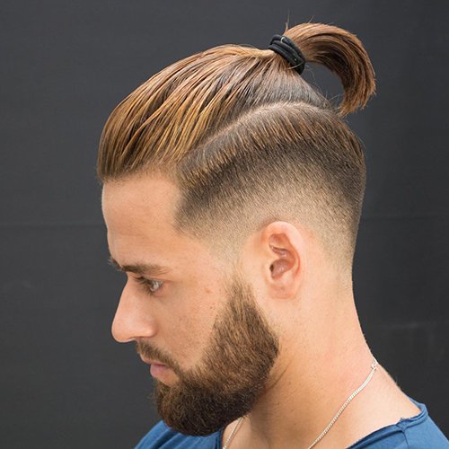 9 - Low fade haircut with beard and ponytail