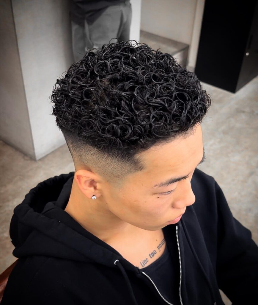 Curly Top Enigma Taper Fade Haircut with Textured Curls