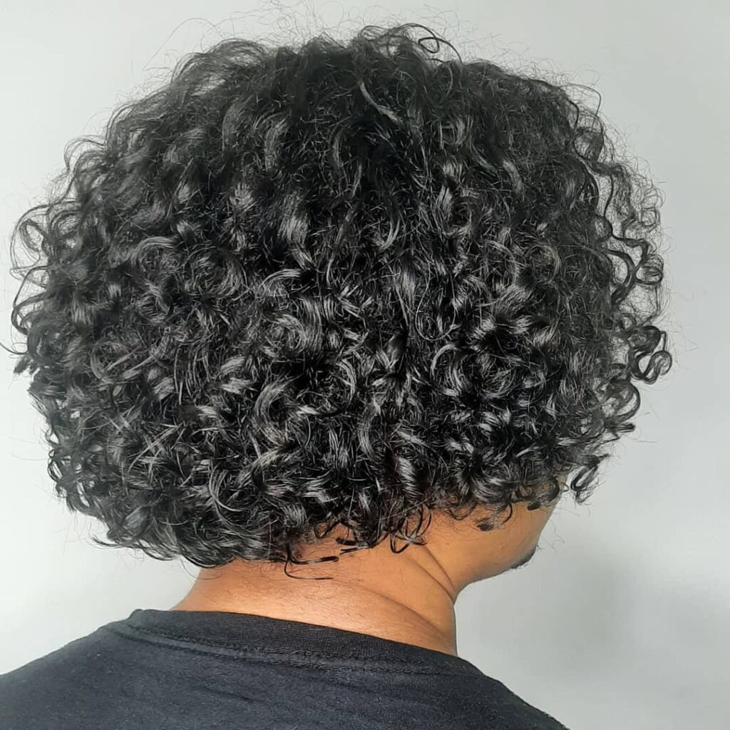 Naturally Refined Curly Hair Man Hairstyle with Volume and Texture