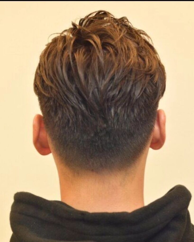 Textured Elegance Mens Slick Back Hairstyle with Layered Volume
