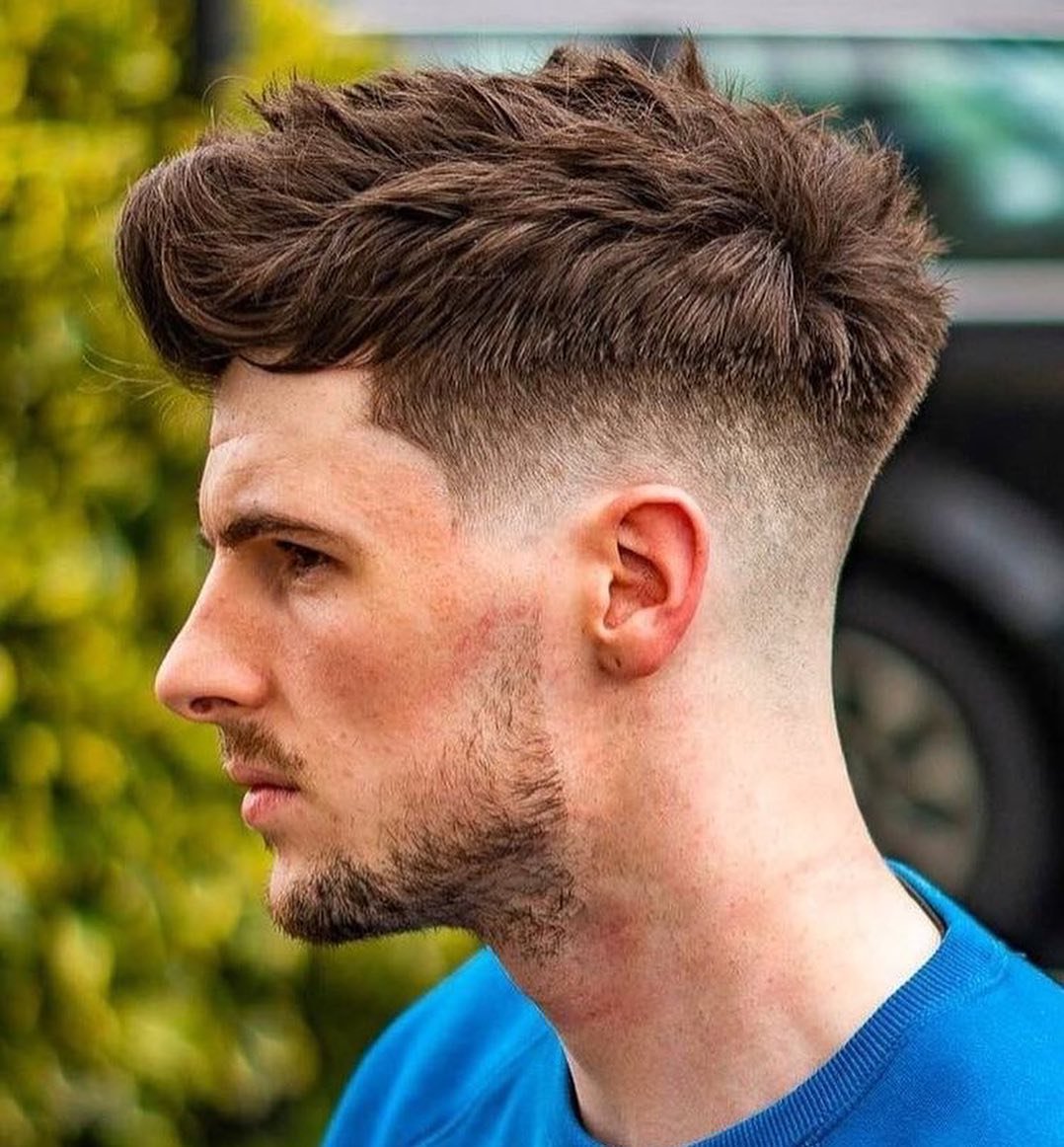 Modern 16 Low Burst Fade Haircut for Men Trending in 2025 12 Windswept Wonder A Burst Fade Haircut with Movement